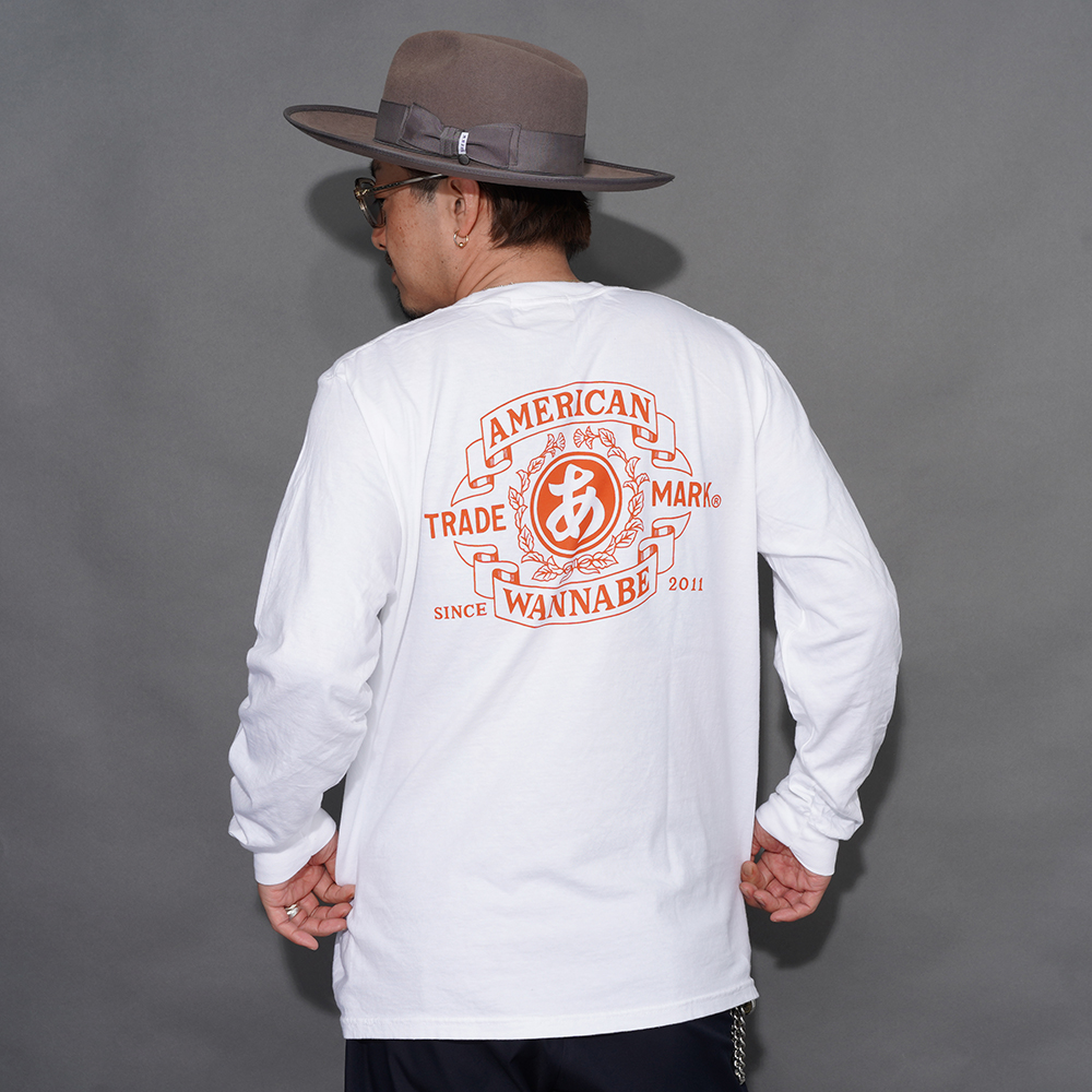 THE AMERICAN WANNABE/アメリカンワナビー「TRADE MARK L/S TEE / WHITE」プリントL/S Tシャツ
