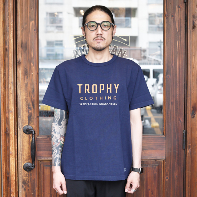 TROPHY CLOTHING/トロフィークロージング「HARVEST WORK OD TEE / NAVY」プリントＴシャツ