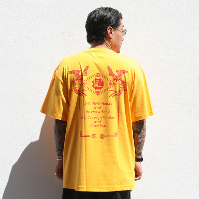 限定】BUDDY JOKES×AMERICAN WANNABE「AMERICAN JOKES S/S TEE / GOLD 