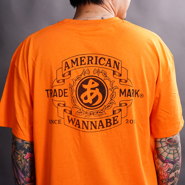 AWTO-260101 /「TRADE MARK S/S TEE / ORANGE」プリントS/S Tシャツ