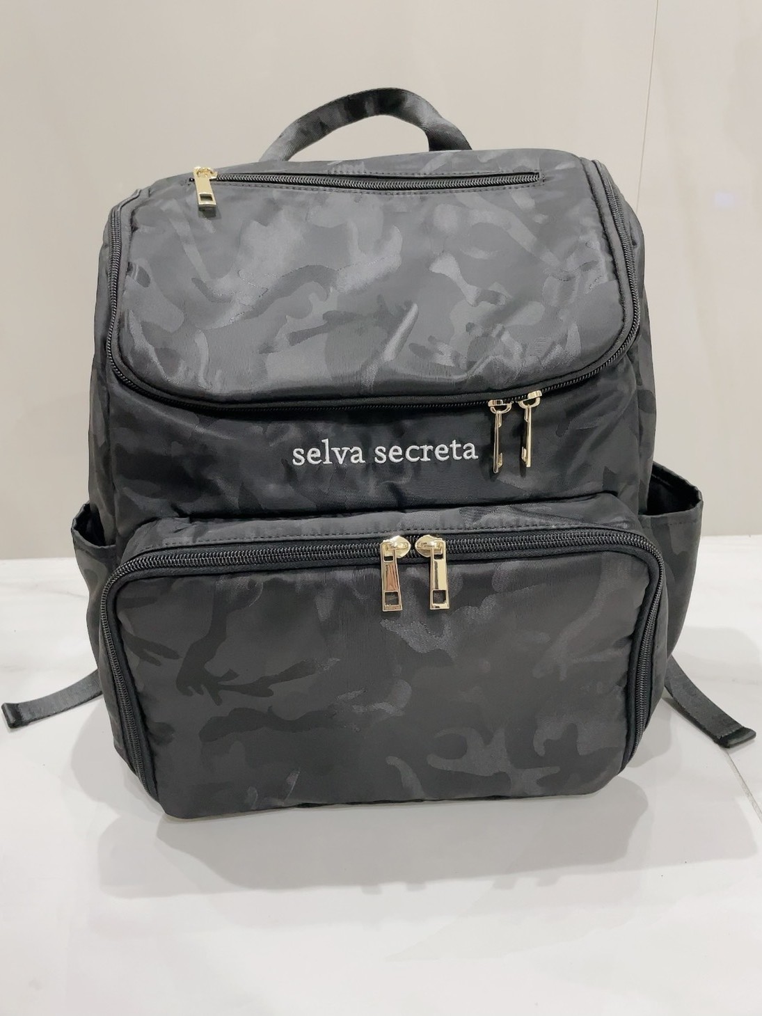 【selva secreta】bucket RUCKSACK(camouflage-black×gold)