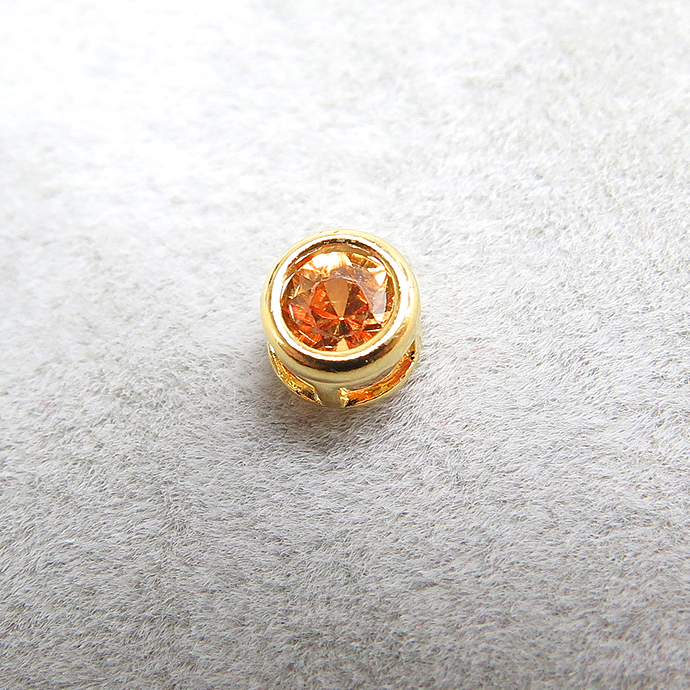 ゴールドフィルド・チャーム/天然石オレンジサファイア（加熱処理・アフリカ）（ラウンド3mm）ベゼル「14kgf」（1個）