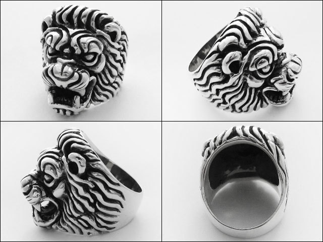 ライオン シルバー指輪 目が青い石。キラキラリングくわえてますの通販  