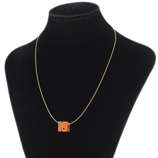 エルメスカージュドアッシュHキューブネックレスオレンジ/ゴールド