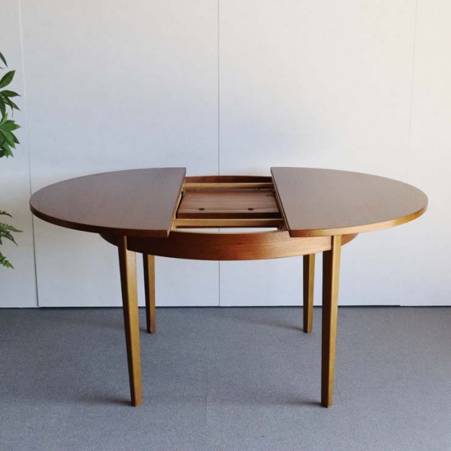 ヴィンテージの真ん中が伸びる円形の木製ダイニングテーブル