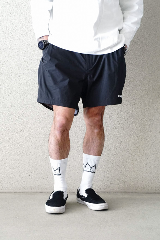 COMFY OUTDOOR GARMENT "COMP SHORTS COEXIST" BLACK