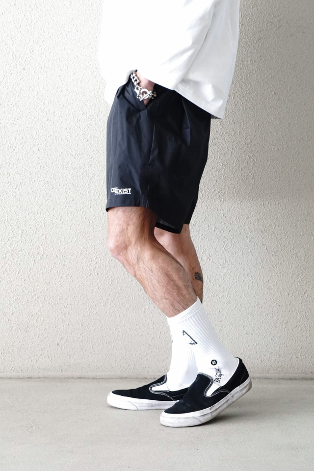 COMFY OUTDOOR GARMENT "COMP SHORTS COEXIST" BLACK