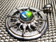 次回入荷未定 5A アンモライト 太陽モチーフ ペンダントトップ 外径32mm 石直径10mm 幸運を呼び込む石 一点もの silver925 カナダ産