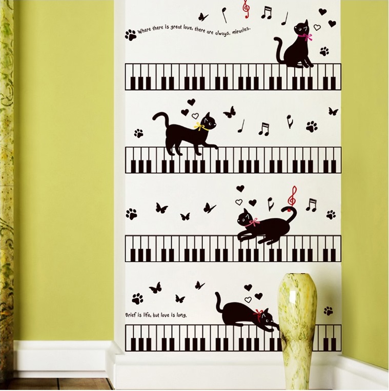 <お安くしています！>猫と鍵盤