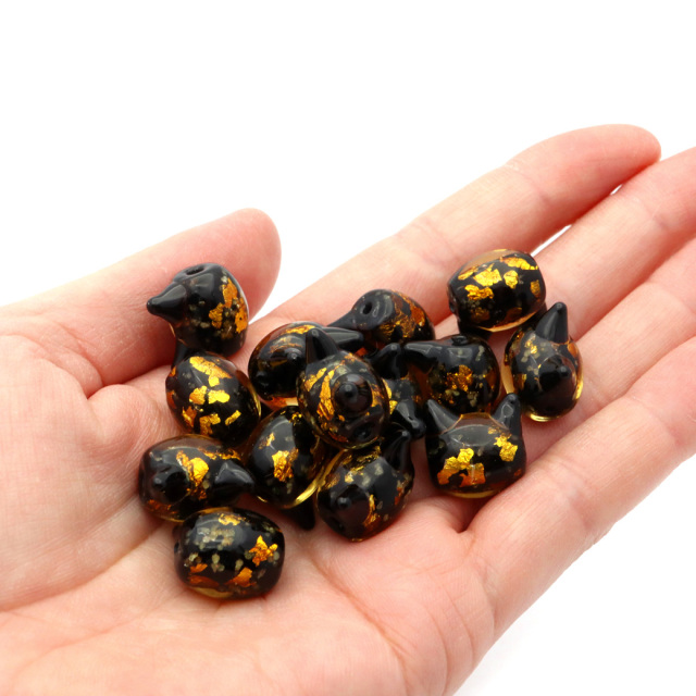 ホタルガラス ねこ ビーズ 1粒 光る 蓄光 イエロー ゴールド パーツ 猫 ネコ 制作 粒売り手芸 黄色 金色 かわいい 招き猫