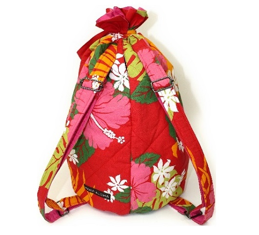 赤い地に白いティアレとハイビスカス模様のリュックタイプのイプケ－ス