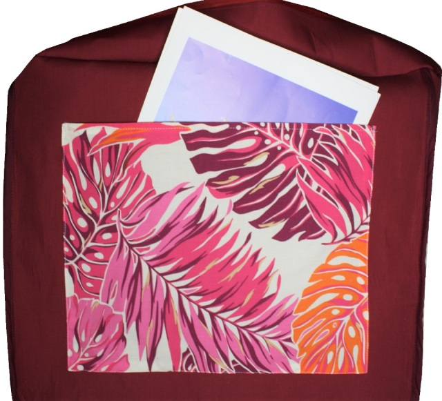 生成り地にピンク、オレンジ。えんじの大きなラウアエの葉模様がすてきなポケットいっぱいのバッグ