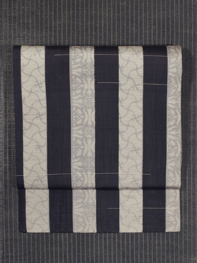 縞文様に分銅と七宝文様 絣織り 紗 名古屋帯　