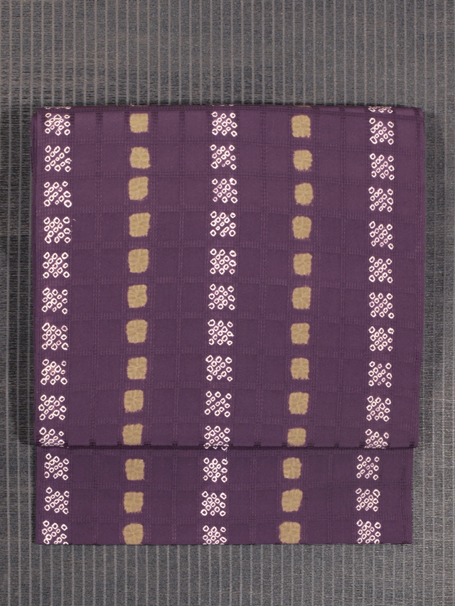 格子縞の変わり織りに鹿の子文様 紫根絞り染め 名古屋帯