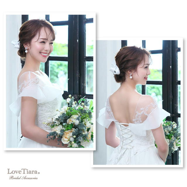 シニヨンヘアとリボヘッドドレスと合わせた女性のイメージ