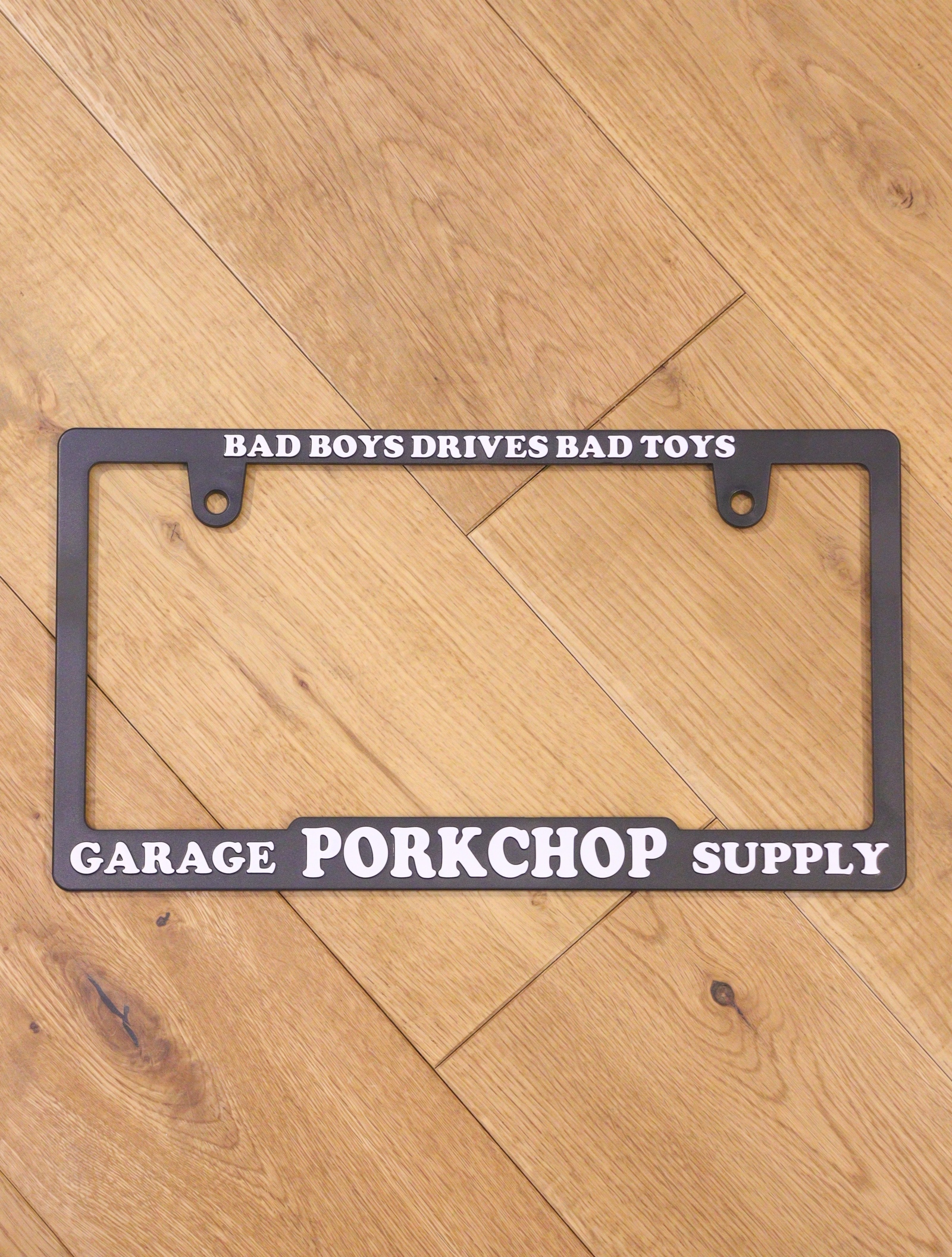 PORKCHOP GARAGE SUPPLY　「 RAISED LICENSE FRAME  (BAD TOYS)」　　ライセンスフレーム