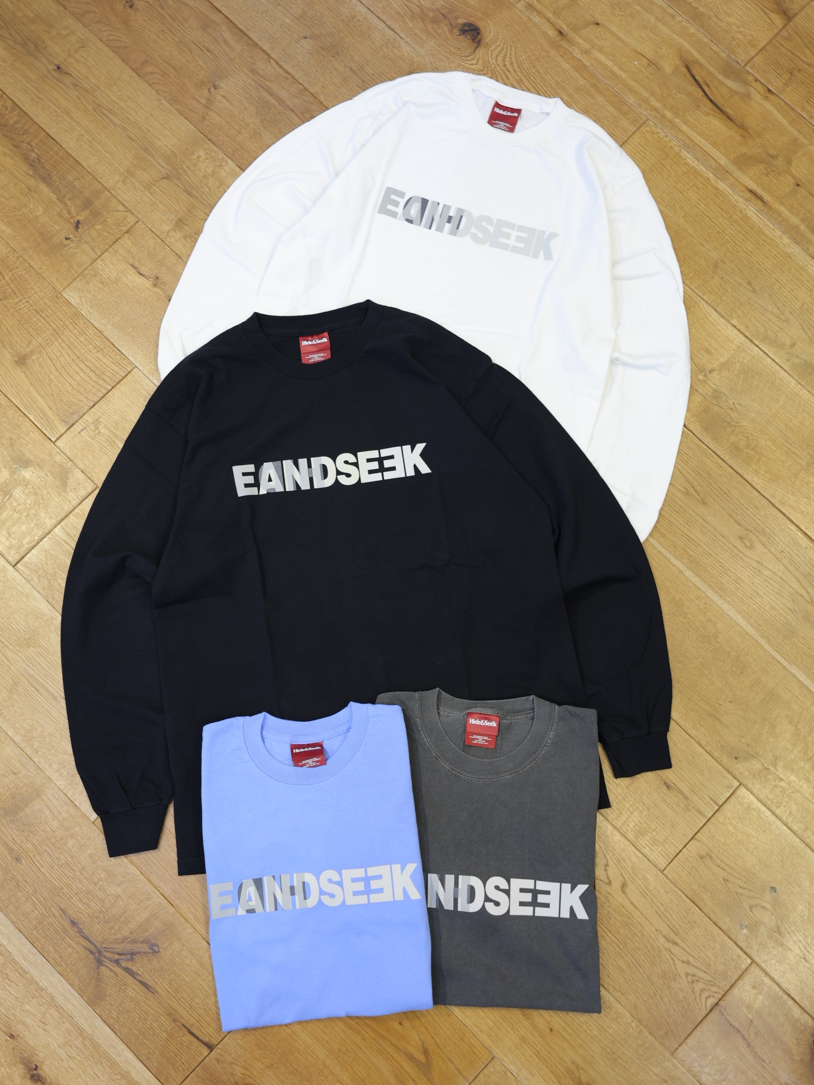Hide and Seek　「E-Logo L/S Tee（26aw）」　プリントロングスリーブティーシャツ
