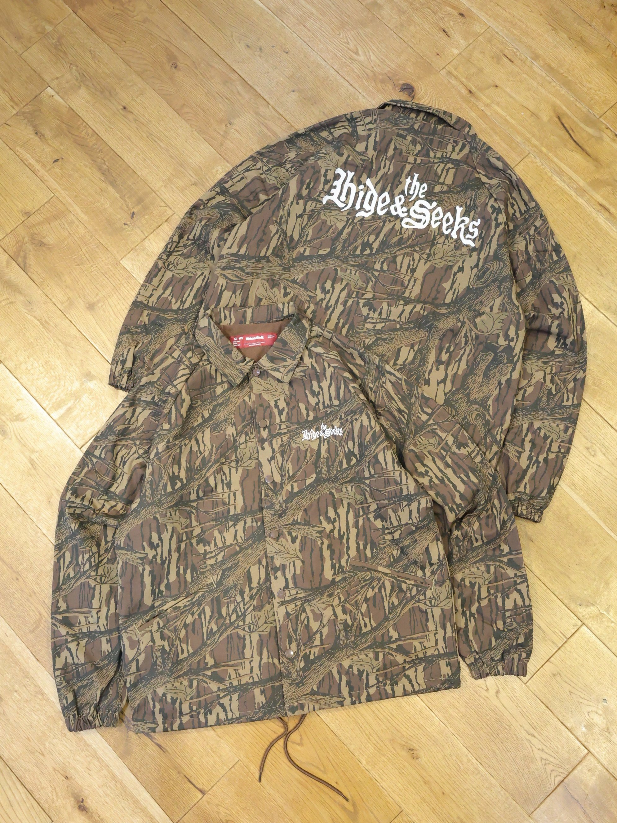 Hide and Seek × Toru Nishiura　「The H&S Team Jacket」　コーチジャケット（CAMO）
