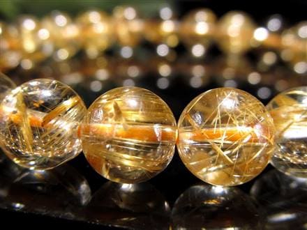 石街] タイチン入りゴールドルチルクォーツ約5mm小玉3層ブレスレット  