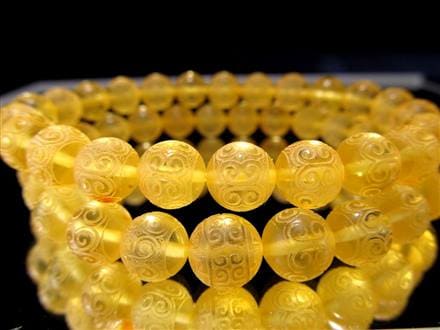 琥珀色の蜜蝋の僧侶の彫刻 琥珀色の蜜蝋の僧侶の彫刻