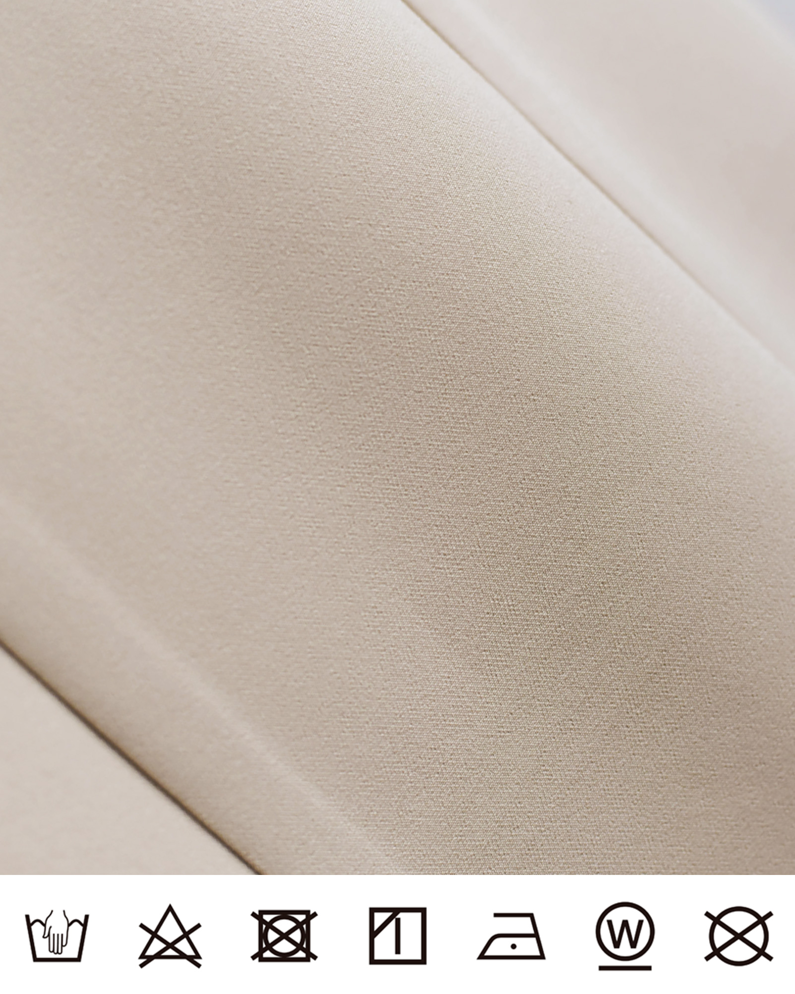 上品でなめらかな質感のベージュ生地アップ、肌触りの良さが際立つ