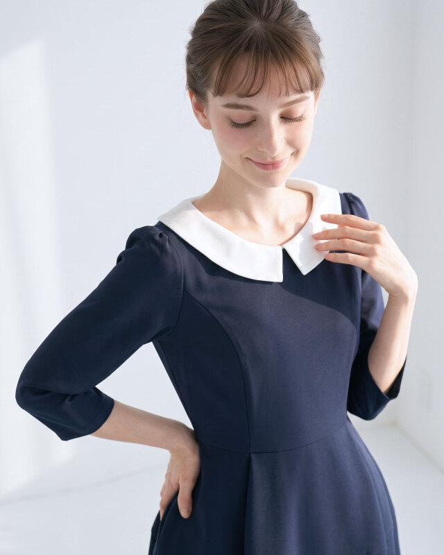 デコルテを美しく見せる白襟デザイン。清楚で上品な印象を与える大人のきれいめワンピース。レジーナ【神戸ワンピース専門店】