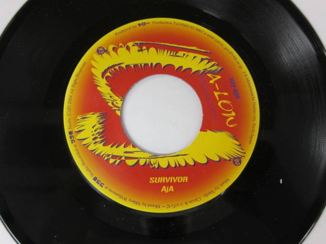 AJA / SURVIVOR / YA-LOW PRODUCTION