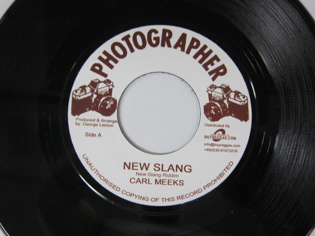 Aside CARL MEEKS / NEW SLANG / Bside DADDY LILLY / SHOCKING SHOKING / NEW SLANG RIDDIM / PHOTOGRAPHER