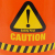 オレンジボディにCAUTION / WARNINGマークが2面に施された５ガロンバケツ。