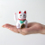 手を動かして幸運を招いてくれる、ラッキーキャットのトイ。
