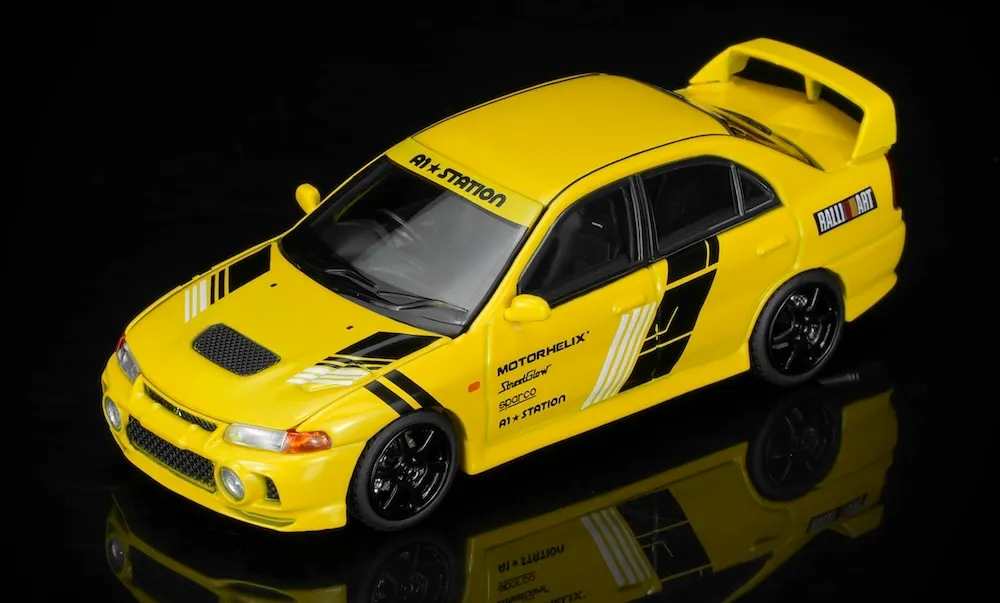 [予約] モーターヘリックス 1/64 ミツビシ ランサーエボリューション4 GSR テックラップ イエロー　M64028