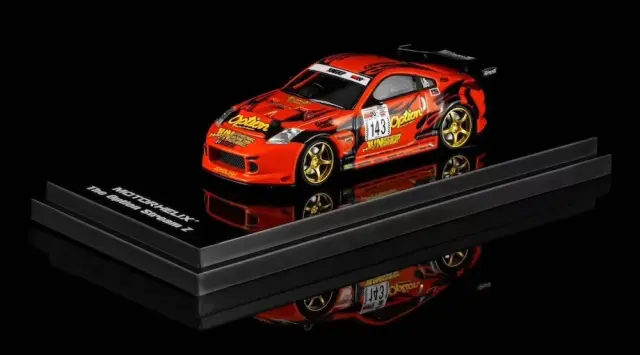 [予約] モーターヘリックス 1/64 ニッサン フェアレディZ (Z33) オプション ストリームZ No.143 稲田大二郎 オレンジ　M63851