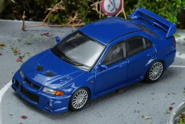 [予約] モーターヘリックス 1/64 ミツビシ ランサーエボリューションVI GSR イッセル ブルーパール　M64205