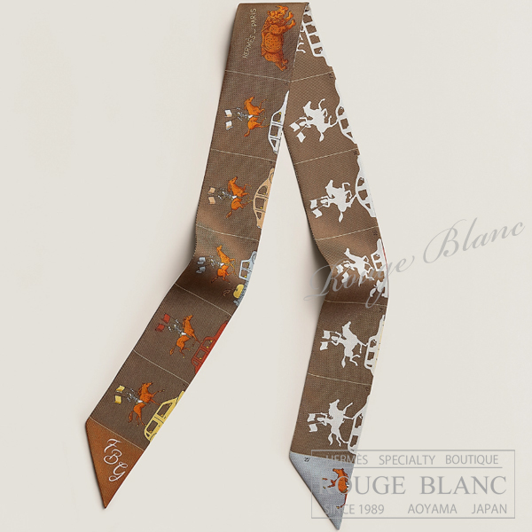 エルメス　ツイリースカーフ　"エルメス・パラード"　マロン×グレー×オレンジ　【新品】HERMES Twilly Scarf  "Hermes Parade" Marron×Gris×Orange 【NEW】