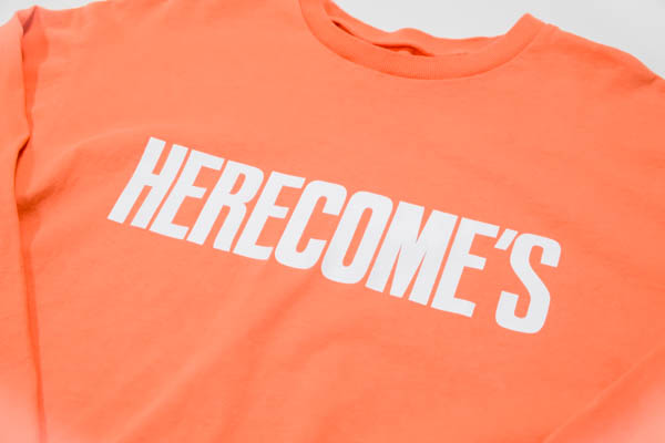 スラッピーサプライ HERECOMES LS TEE 長袖Tシャツ オレンジ / HERECOME'Sプリント アップ