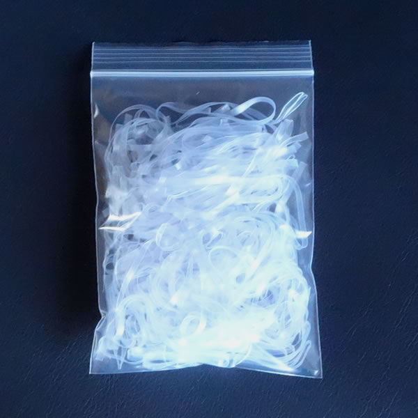 マスク耳掛け用バンド　折径110mm  100g　洗浄　透明　（約560本）