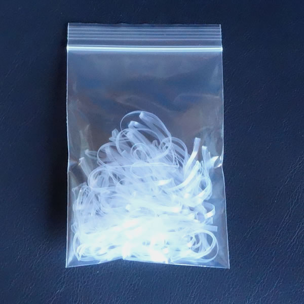 マスク耳掛け用バンド　折径110mm  10g　洗浄　透明　（約50本）