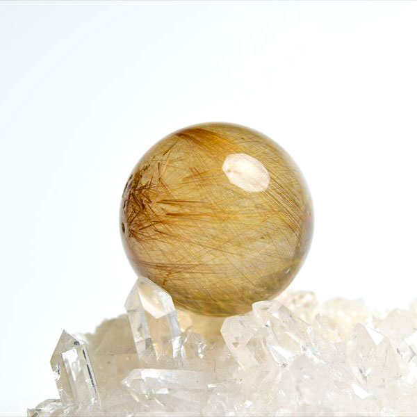 ゴールドルチルクォーツ 丸玉 置物｜株式会社オンビル 